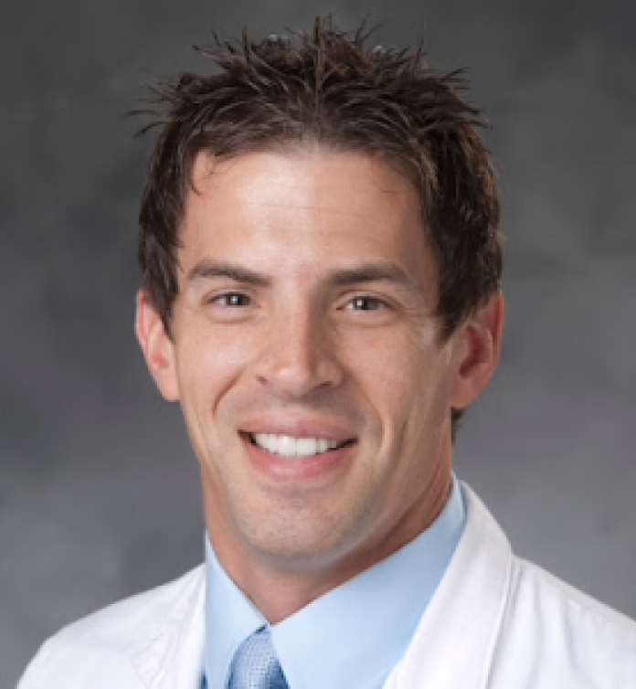 A photo of Micah T. McClain, MD, PhD.